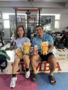 Gym Buddies holding Melonia Juice Drink Pouches
