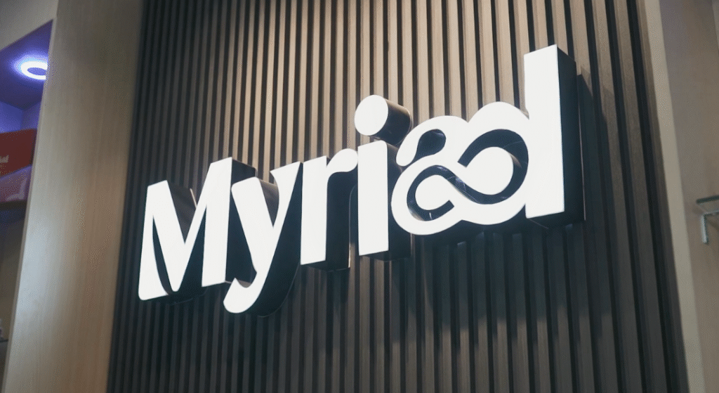 Myriad Skincare Acrylic Lighted Signage on Dark Fluted Panel